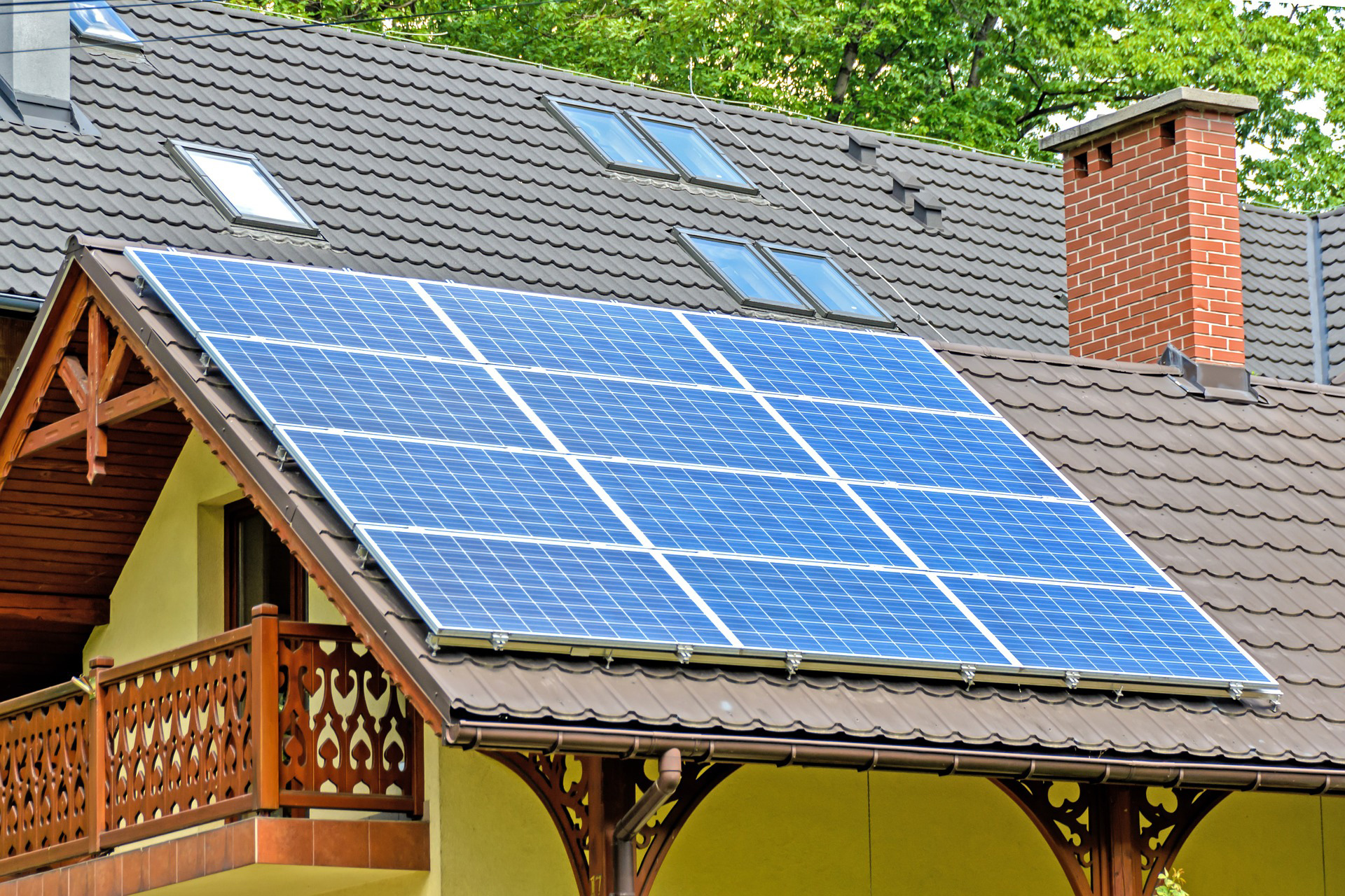 Solar panel installation crew mounting Qcells panels on a California Central Valley roof